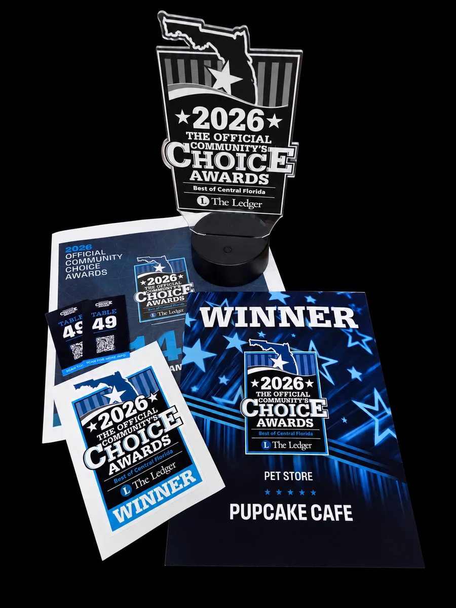 Pupcake Cafe’s 2026 Official Community’s Choice Awards winner trophy, certificate and window decal for Pet Store, from The Ledger